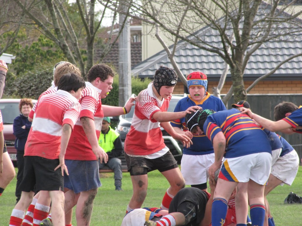 Luke, red jersey & black headgear, about to enter the fray